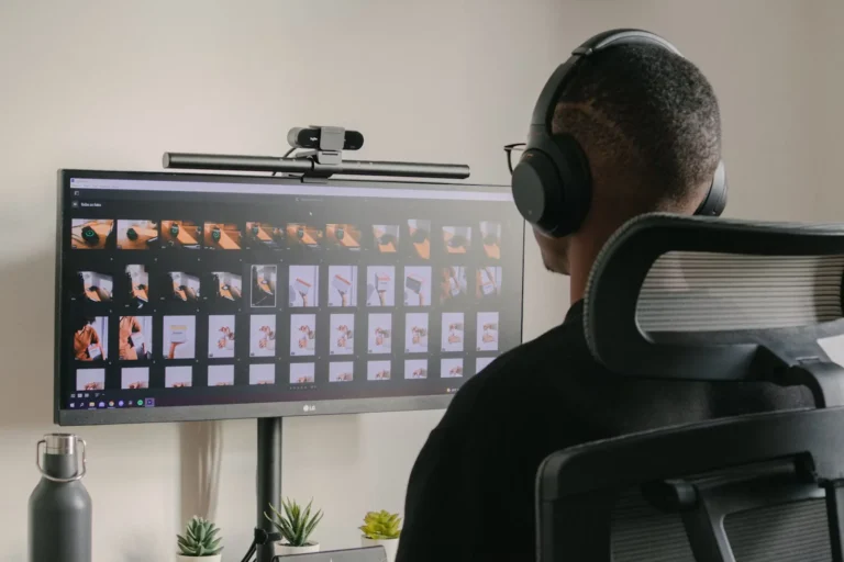 a large screen and a person working on it